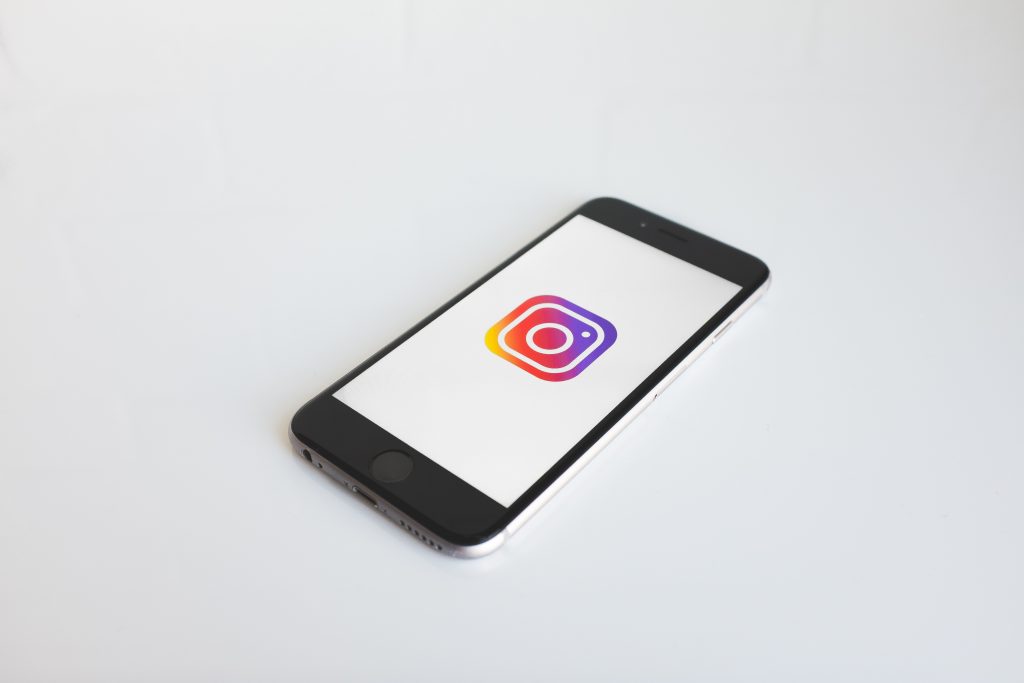 Mobile phone with Instagram logo on it.