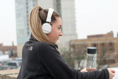 Girl resting after exercise with headphones on